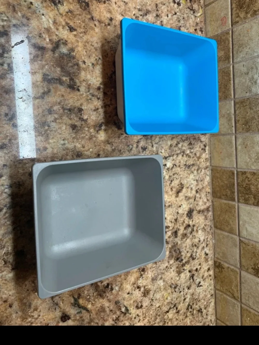 IKEA VARIERA blue and grey plastic square cereal bowls.